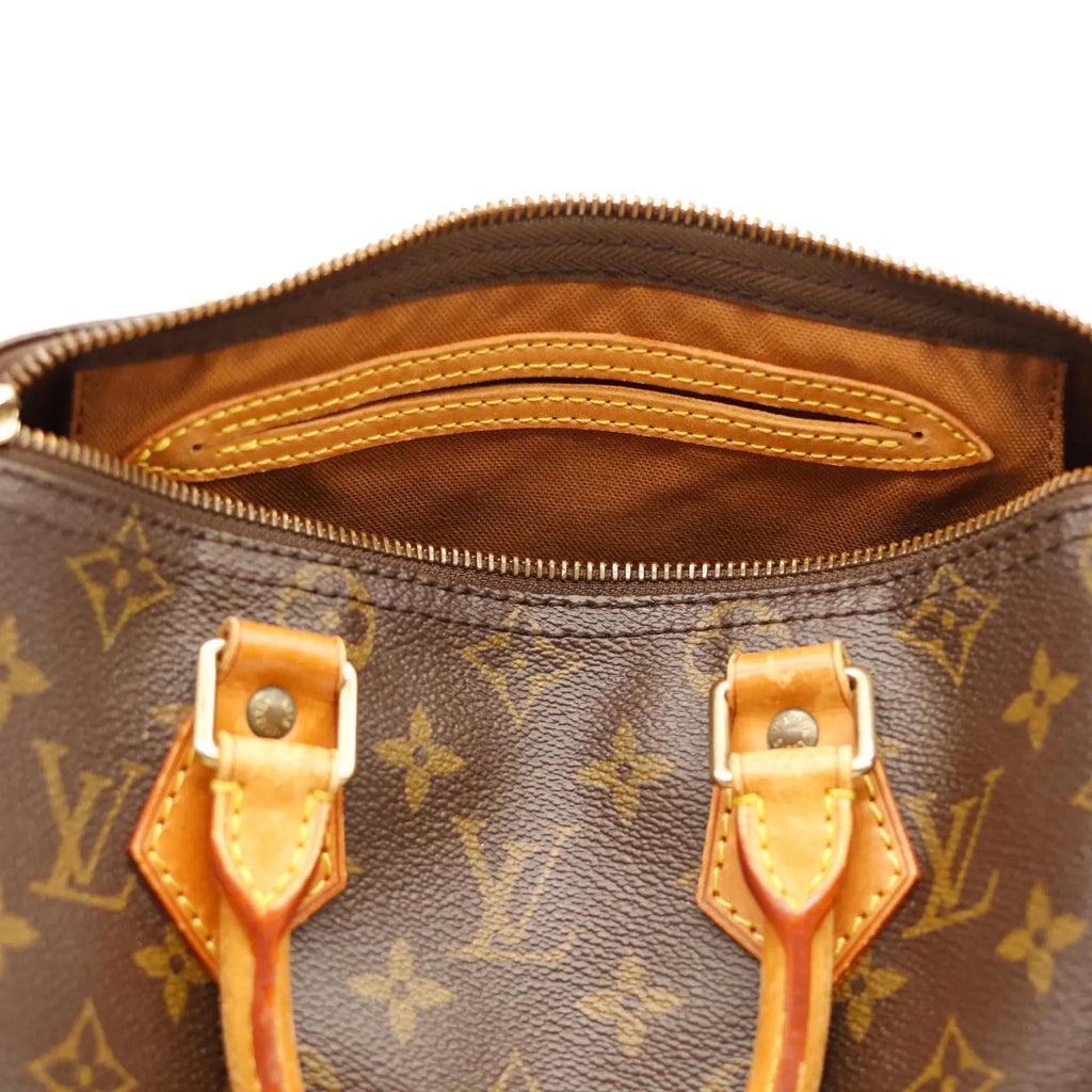 Sac Louis Vuitton Speedy 25 en toile Monogram, sac de luxe d’occasion authentique disponible chez Sorayae.