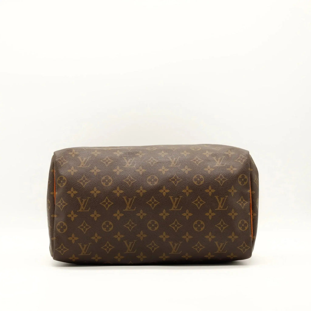 Sac Louis Vuitton Speedy 35 en toile Monogram, sac de luxe d’occasion authentique disponible chez Sorayae.