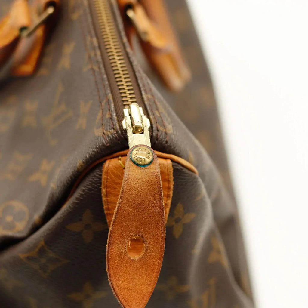 Sac Louis Vuitton Speedy 35 en toile Monogram, sac de luxe d’occasion authentique disponible chez Sorayae.